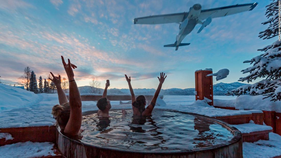 &lt;strong&gt;Quite the view: &lt;/strong&gt;Skiers cheer a flyover from the hot tub après-ski at Tordrillo&#39;s lodge.