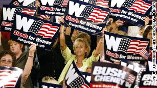 Women cheer on US President George W. Bush as he arrives to deliver remarks on September 17, 2004, during a &quot;Focus On Women&#39;s Issues&quot; event in Charlotte, North Carolina.