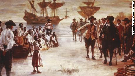 An engraving shows the arrival of a Dutch slave ship with a group of African slaves for sale in Jamestown, Virginia, in 1619. 