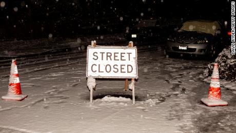 A sign blocks drivers from using an unsafe road in Seattle. 