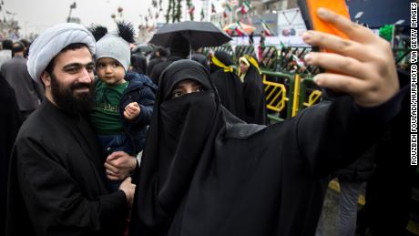 Iranians enjoy the ceremony on Monday.