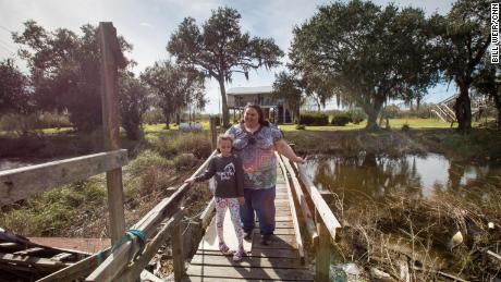 Chantel Comardelle, here with her daughter, says her grandmother is refusing to leave the island.