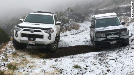 This Sunday, Feb. 10, 2019, photo shows snow on the ground in Polipoli Spring State Recreation Area in Kula, Hawaii on the island of Maui. A strong storm that hit Hawaii knocked out power, brought down tree branches, flooded coastal roads — and even brought snow. Snow is not unheard of in mountainous parts of the tropical island chain, but officials say the coating at 6,200 feet (1,900 meters) at a state park on Maui could mark the lowest-elevation snowfall ever recorded in the state. (Lance Endo via AP)