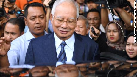 TOPSHOT - Former Malaysia&#39;s prime minister Najib Razak leaves the courthouse in Kuala Lumpur on December 12, 2018 after being charged in court. - Malaysian ex-leader Najib Razak and Arul Kanda, the former 1MDB head were charged on December 12 with altering an audit of the state fund at the centre of a scandal which helped topple the last government. (Photo by MOHD RASFAN / AFP)        (Photo credit should read MOHD RASFAN/AFP/Getty Images)