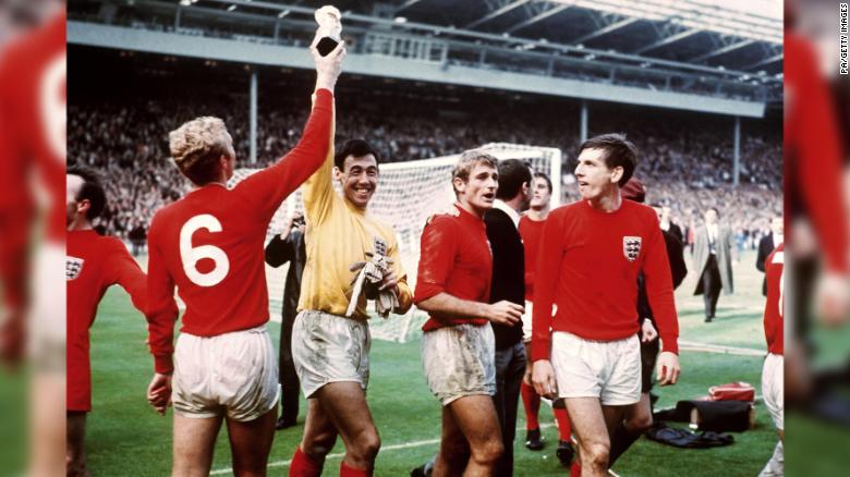 England captain Bobby Moore tries to retrieve the Jules Rimet trophy from goalkeeper Gordon Banks.