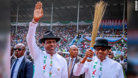 Nigerian President Muhammadu Buhari, right, greets supporters on Tuesday, February 12, 2019, during a campaign rally in Rivers State ahead of the country&#39;s presidential election.