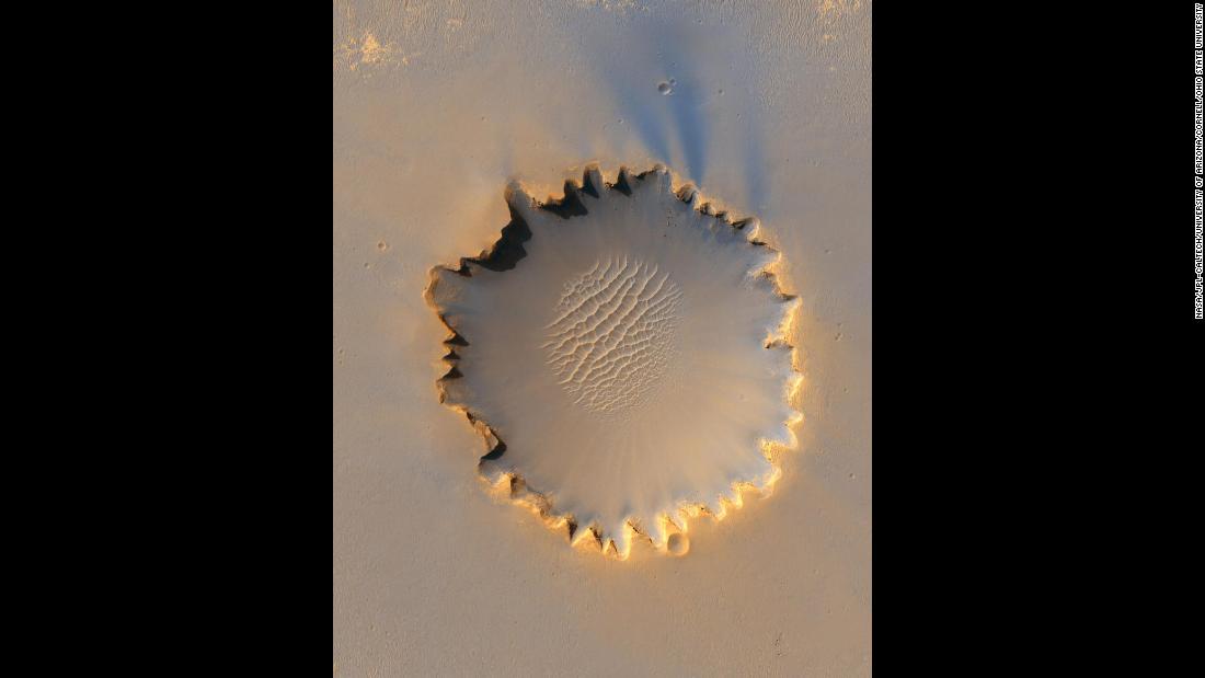 The Mars Reconnaissance Orbiter took this photo of Victoria Crater, about a half-mile in diameter. It was Opportunity&#39;s home for 14 of the first 46 months it spent on Mars. 