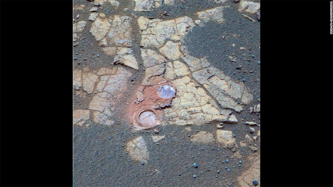 Opportunity&#39;s panoramic camera took this photo of outcrop rocks that it encountered on its journey in 2005. Cracks and other features are obvious. The two holes visible were drilled by the rover to expose the underlying material.