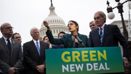 Representative Alexandria Ocasio-Cortez, a Democrat from New York, speaks as Senator Ed Markey, a Democrat from Massachusetts, right, listens during a news conference announcing Green New Deal legislation in Washington, D.C., U.S., on Thursday, Feb. 7, 2019. A sweeping package of climate-change measures unveiled Thursday by Ocasio-Cortez drew a tepid response from House Speaker Nancy Pelosi who didn't explicitly throw her support behind the measure. Photographer: Al Drago/Bloomberg via Getty Images