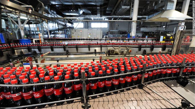 Coca-Cola said costs from refranchising its bottling system contributed to a dip in revenue last year. 