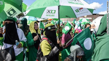 Supporters of the Malaysia Islamic Party (PAS) gather during the election nomination day in Pekan on April 28, 2018.