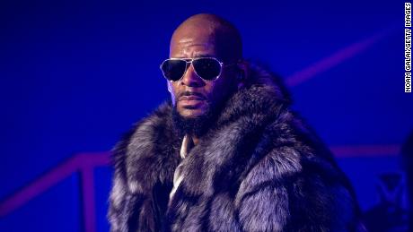 R. Kelly turns himself in to Chicago police after being indicted on sexual abuse charges