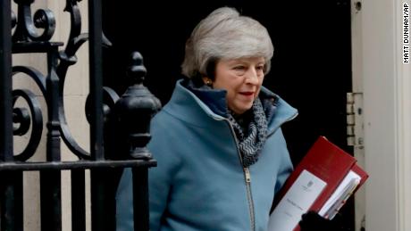 British Prime Minister Theresa May leaves 10 Downing Street in London to attend Prime Minister's Questions at the Houses of Parliament on Wednesday. 