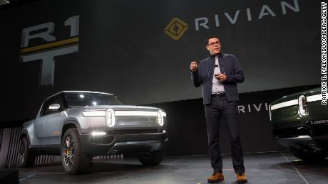 RJ Scaringe, founder and chief executive officer of Rivian Automotive Inc., unveils the R1T electric pickup truck and R1S electric SUV in Los Angeles.