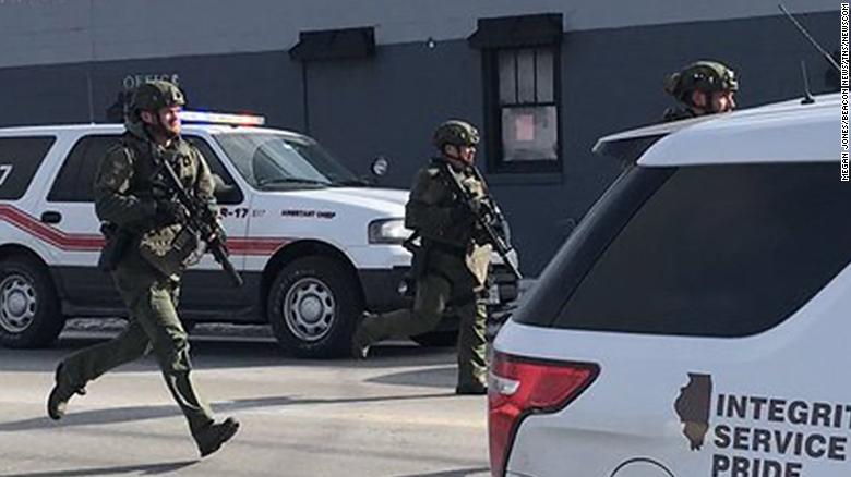 The scene in Aurora, photographed by Beacon News crime reporter Megan Jones, of the on-going possible active shooter. Dozens of area police officers have responded to the situation, and there are many injuries, according to Kendall County Dispatch. (Megan Jones/Beacon News/TNS)