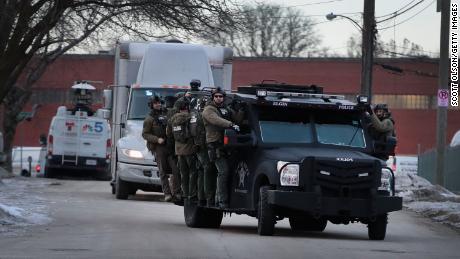 Police secure the area following a shooting at the Henry Pratt Company on February 15, 2019 in Aurora, Illinois. 