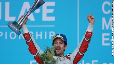Lucas Di Grassi celebrates his victory on the podium.