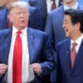 BUENOS AIRES, ARGENTINA - NOVEMBER 30: (L-R) President of  U.S. President Donald Trump and Prime Minister of Japan Shinzo Abe talk during the family photo opening day of Argentina G20 Leaders&#39; Summit 2018 at Costa Salguero on November 30, 2018 in Buenos Aires, Argentina. (Photo by Daniel Jayo/Getty Images)