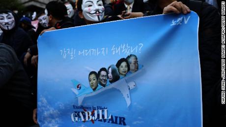 Korean Air pilots, cabin crew and activists, many wearing Guy Fawkes masks, attend a rally on May 4, 2018 in Seoul, South Korea. 