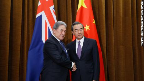 China's Foreign Minister Wang Yi (right) and New Zealand's Foreign Minister Winston Peters shake hands in Beijing on May 25, 2018. Tensions have grown between Auckland and Beijing in recent months. 