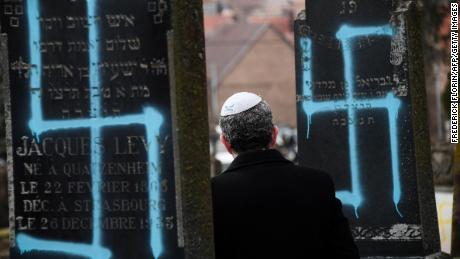 Protesters rally against anti-Semitism in France after more graves vandalized