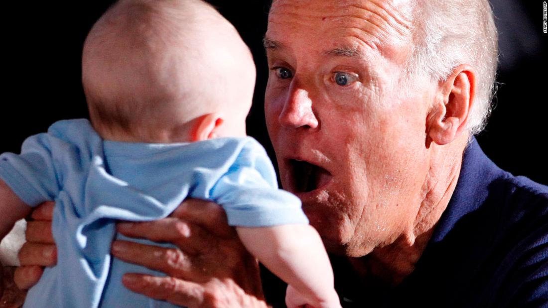 Biden holds a baby during a campaign event in Eau Claire, Wisconsin, in September 2012.