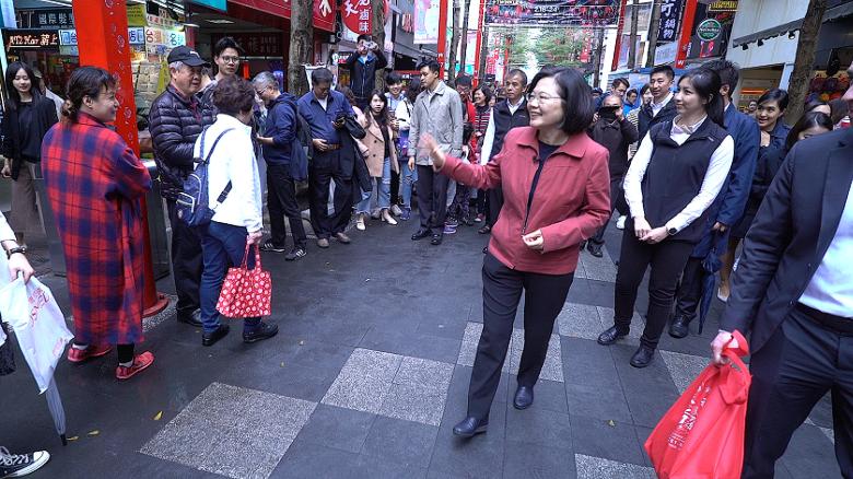 Tsai meets with her constituents on a street in the capital Taipei on February 18.
