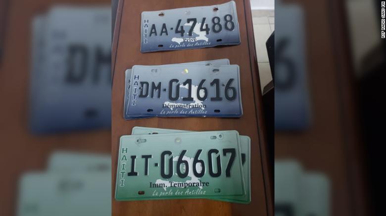 The detainees were allegedly found in posession of multiple license plates.