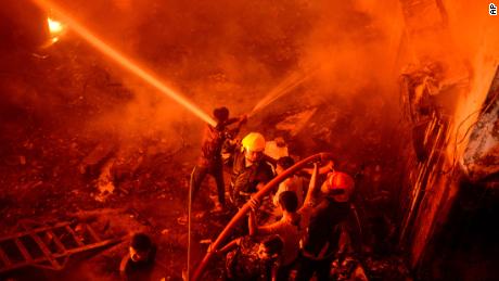 Firefighters try to douse flames in Dhaka, Bangladesh on February 20, 2019.