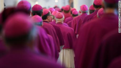 Members of the German Bishops&#39; Conference enter the cathedral to attend the opening mass of the conference on September 25, 2018 in Fulda, western Germany. - Germany&#39;s Catholic Church is due on September 25, 2018 to confess and apologise for thousands of cases of sexual abuse against children, part of a global scandal heaping pressure on the Vatican. It will release the latest in a series of reports on sexual crimes and cover-ups spanning decades that has shaken the largest Christian Church, from Europe to the United States, South America and Australia. (Photo by Arne Dedert / dpa / AFP) / Germany OUT        (Photo credit should read ARNE DEDERT/AFP/Getty Images)