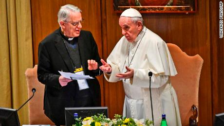 Pope Francis seen speaking with Rev. Federico Lombardi, left, the former Vatican spokesman who is moderating the summit, on Thursday.