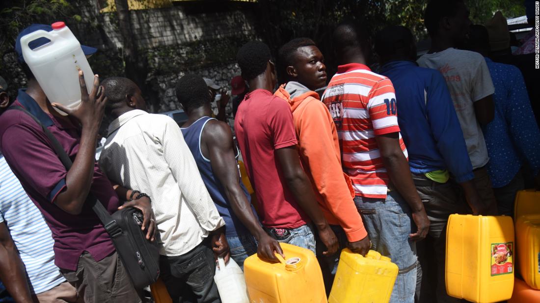 People wait in line for gas in the Port-au-Prince commune of Petion-Ville on Sunday, February 17.