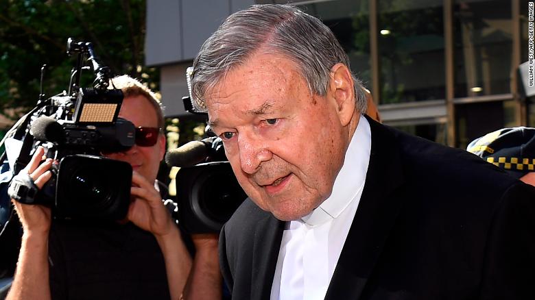 Cardinal George Pell walks to a car in Melbourne on December 11, 2018.