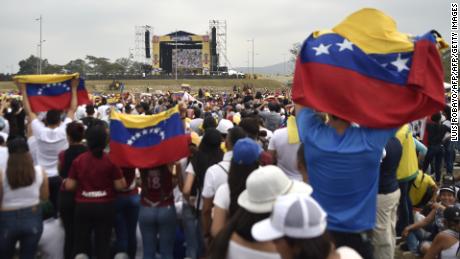 People await the start of Friday's concert organized by Richard Branson in Cucuta, Colombia.