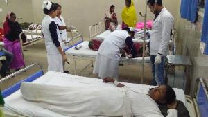 Indian victims are under medical treatment at Jorhat hospital after allegedly drinking toxic bootleg liquor in Assam&#39;s Golaghat district on February 22, 2019. - Twenty-five members of a tribe of Indian tea pickers, including 15 women, died painful deaths within hours of drinking poisoned alcohol, police said on February 22. The deaths in the northeastern state of Assam came less than two weeks after about 100 people died after drinking tainted licquor in Uttar Pradesh and Uttarakhand states. (Photo by Biju BORO / AFP) (Photo credit should read BIJU BORO/AFP/Getty Images)