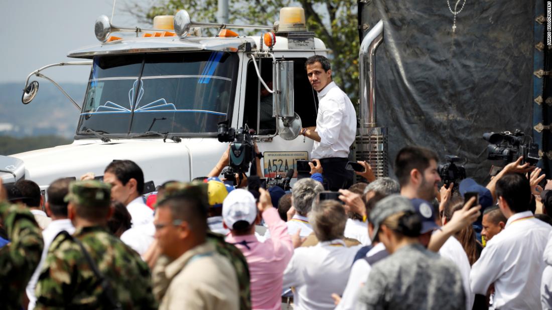 Venezuelan opposition leader Juan Guaidó stands on a truck carrying humanitarian aid for Venezuela on February 23. &quot;We have peaceful intentions regarding this humanitarian and multilateral effort,&quot; Guaido said, speaking at the Colombia-Venezuela border. He described it as a &quot;peaceful effort that wants to save lives.&quot;