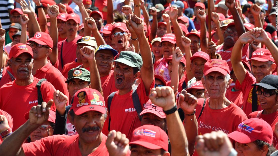 Supporters of President Maduro take part in a march in Caracas on February 23.