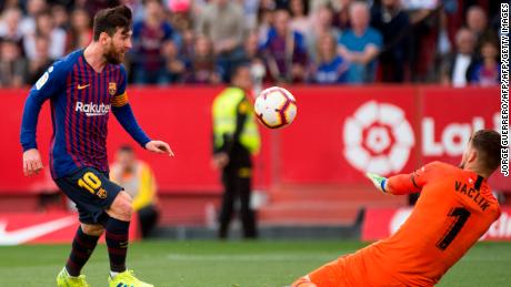 Lionel Messi chips keeper Tomas Vaclik for the winner against Sevilla. 