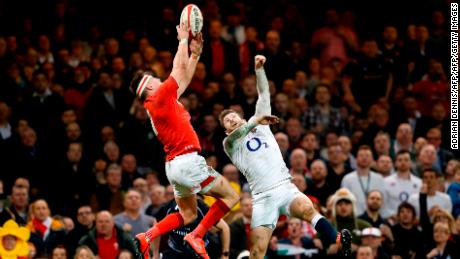 Josh Adams got the better of this aerial duel against Elliot Daly to score Wales' second try against England in the Six Nations. 