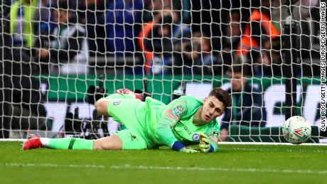 Kepa allows Sergio Aguero's weak penalty to squirm under his hands.