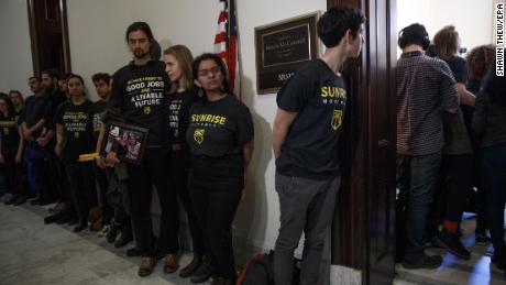 Protesters rally at McConnell's office in support of Green New Deal