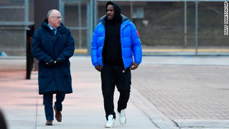 R. Kelly, right, leaves Cook County Jail with his attorney Steve Greenberg on Monday.