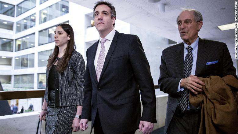 Michael Cohen, former personal lawyer to U.S. President Donald Trump, center, arrives to testify before the Senate Intelligence Committee in Washington, D.C., U.S., on Tuesday, Feb. 26, 2019. Cohen is about to make his long-awaited public appearance before Congress amid partisan debate over how much damage Trump's ex-fixer and longtime lawyer can do to his former boss. Photographer: Anna Moneymaker/Bloomberg via Getty Images
