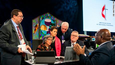 Leaders from the United Methodist Church confer during their conference in St. Louis on Tuesday. 