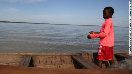 A child slave untangles a fishing net on Lake Volta, Ghana, November 2018.