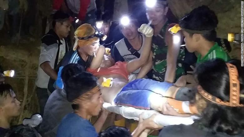 Rescuers work to bring miners out from a collapsed mine in North Sulawesi province, Indonesia.