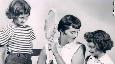 Heldman sits with her sister, Carrie, and her childhood coach, June Stack.