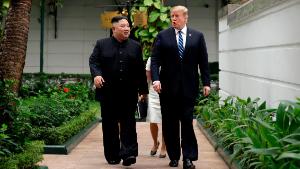 President Donald Trump and North Korean leader Kim Jong Un take a walk after their first meeting at the Sofitel Legend Metropole Hanoi hotel, Thursday, Feb. 28, 2019, in Hanoi. (AP Photo/Evan Vucci)