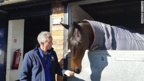 Head lad Clifford Baker shares a moment with stable star Clan Des Obeaux.