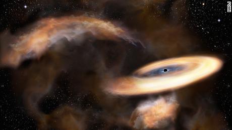 An artist's impression of a gas cloud swirling around a black hole.